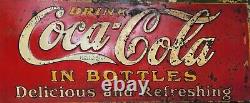 1931 Coca-Cola, 28 X 10, embossed, In Bottles, Delicious & Refreshing, sign