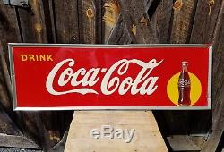 1948 Coca Cola Horizontal Sign with Bottle. 54inx18in. Embossed. Painted metal