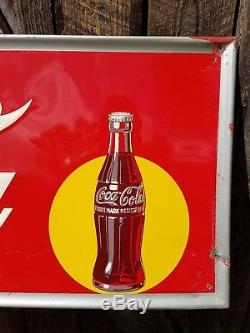 1948 Coca Cola Horizontal Sign with Bottle. 54inx18in. Embossed. Painted metal