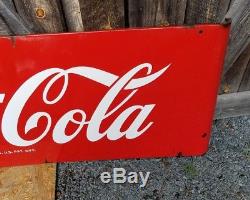 1950s Coca Cola Sled Sign. 68inx24in. Porcelain