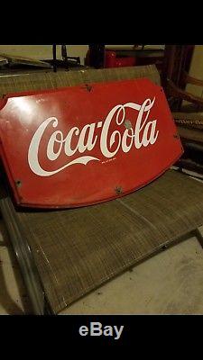 Coca cola shield sign