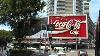 Hop On Hop Off Bus In Sydney At Historic Coca Cola Sign