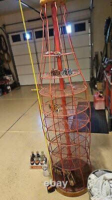 Rare, Tall, used vintage red steel & mesh Coca- Cola display stand collectible